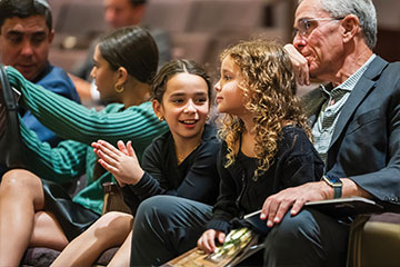 Children sitting in a congregation next to adults. Links to Donor-Advised Funds Children sitting in a congregation next to adults. Links to Donor-Advised Funds