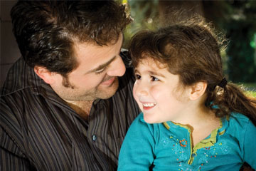 A little girl smiles at her father. Links to Gifts of Life Insurance A little girl smiles at her father. Links to Gifts of Life Insurance